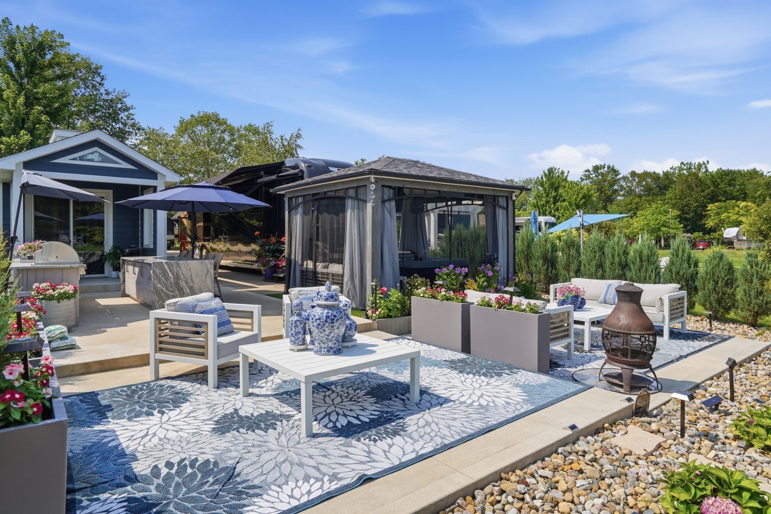 Patio seating area with umbrellas beside the water